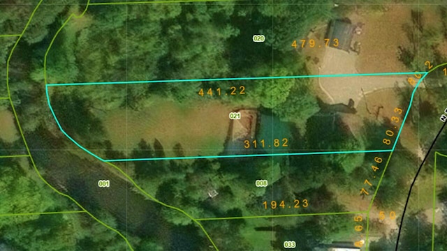 aerial map of property and surrounding area with property parcel outlined