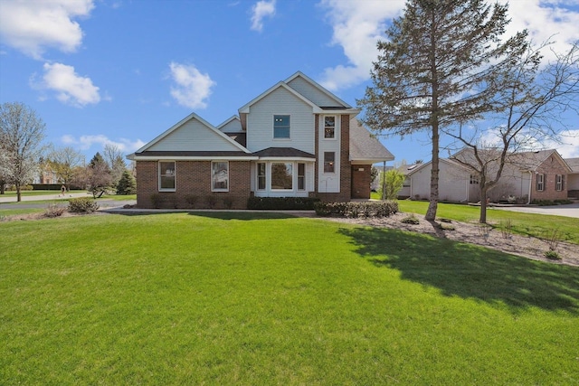 traditional-style house featuring brick siding and a front lawn