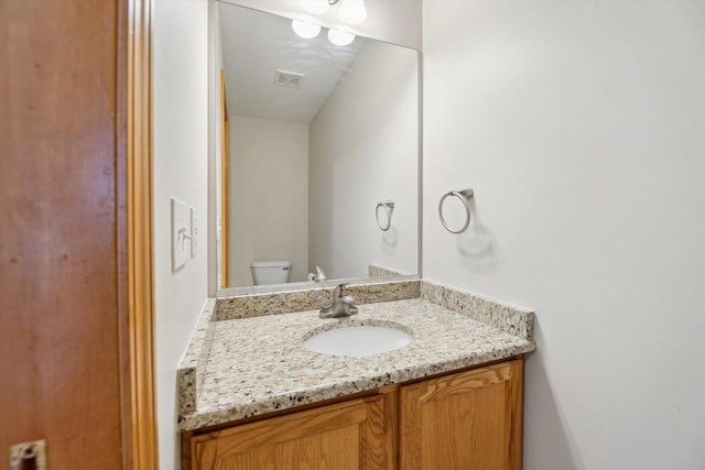 half bath with toilet and vanity
