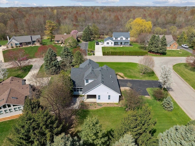 aerial view of residential area with a forest