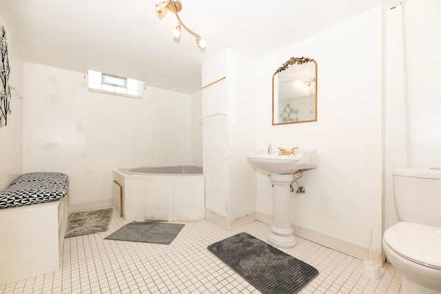 4941 Julius Blvd, Westland, MI 48186 - full bath with toilet, a garden tub, tile patterned flooring, and baseboards