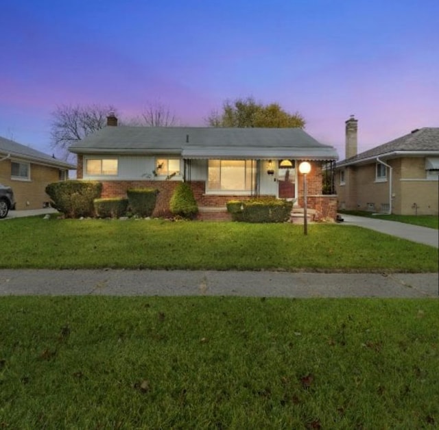 4941 Julius Blvd, Westland, MI 48186 - single story home featuring a front lawn, brick siding, and a chimney