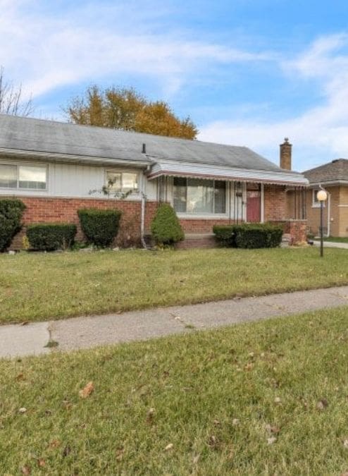 4941 Julius Blvd, Westland, MI 48186 - ranch-style house with brick siding, a chimney, and a front lawn