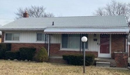 4941 Julius Blvd, Westland, MI 48186 - bungalow-style house featuring brick siding and a chimney