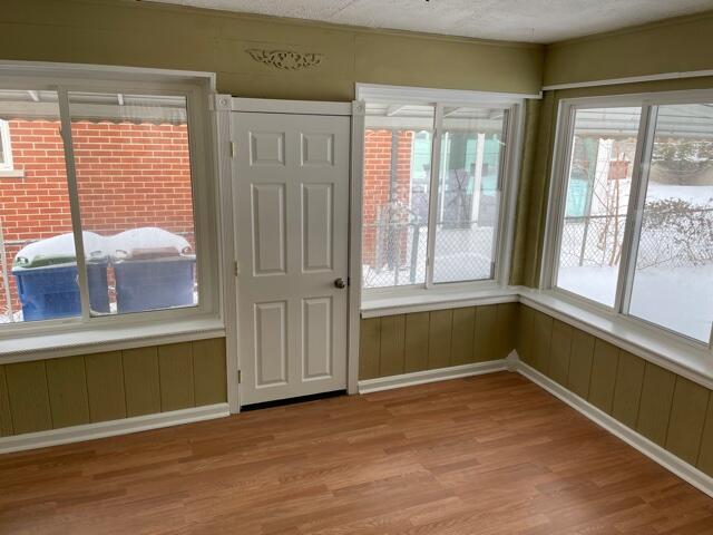 unfurnished room featuring light wood-style floors