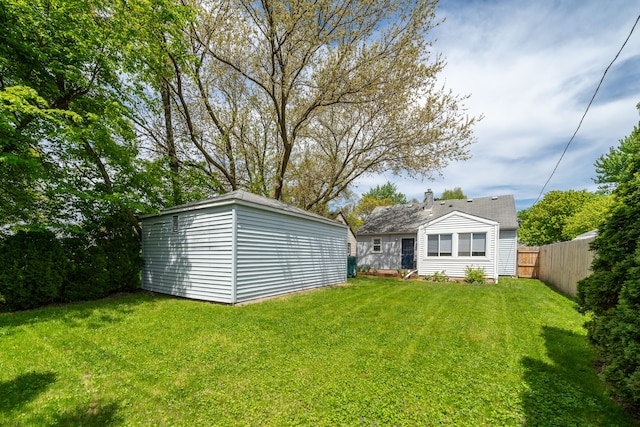 view of yard with an outbuilding and a storage shed