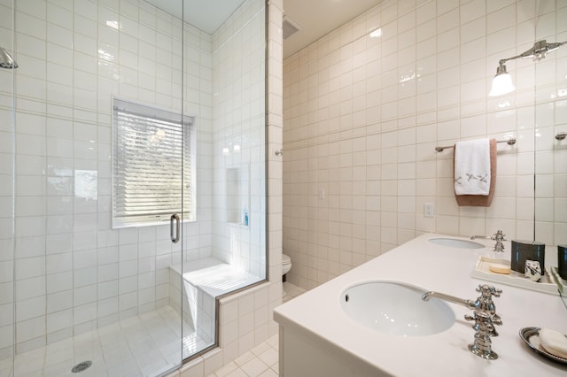 50102 Alpine Blvd, New Buffalo, MI 49117 - full bath with tile walls, a shower stall, toilet, and double vanity