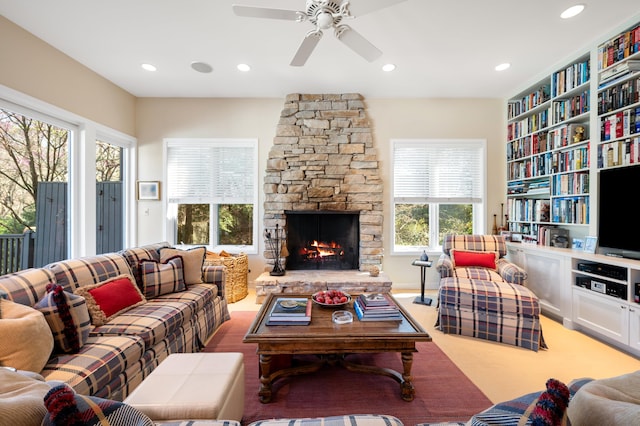 50102 Alpine Blvd, New Buffalo, MI 49117 - living area with ceiling fan, a stone fireplace, recessed lighting, and built in shelves