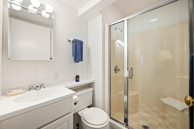 50102 Alpine Blvd, New Buffalo, MI 49117 - bathroom with toilet, a shower stall, tile walls, vanity, and backsplash