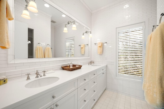 50102 Alpine Blvd, New Buffalo, MI 49117 - full bath with tile patterned flooring, plenty of natural light, tile walls, double vanity, and ornamental molding