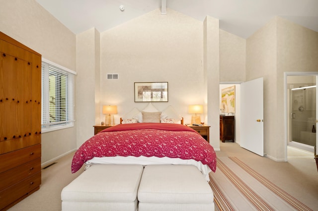 50102 Alpine Blvd, New Buffalo, MI 49117 - bedroom with high vaulted ceiling, light colored carpet, baseboards, and ensuite bath