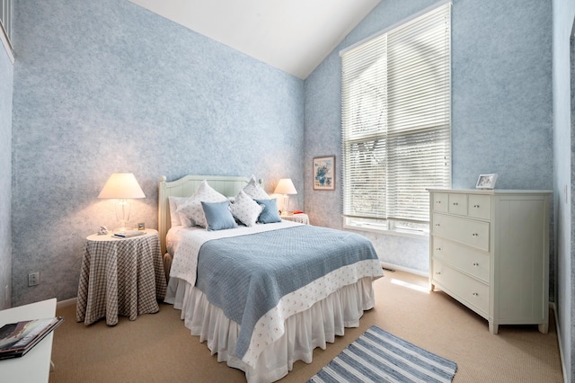 50102 Alpine Blvd, New Buffalo, MI 49117 - bedroom featuring vaulted ceiling, light carpet, and wallpapered walls