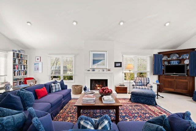 50102 Alpine Blvd, New Buffalo, MI 49117 - living area with lofted ceiling, a lit fireplace, carpet, and recessed lighting