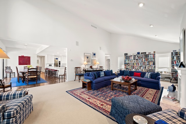 50102 Alpine Blvd, New Buffalo, MI 49117 - living area with high vaulted ceiling, recessed lighting, and carpet floors