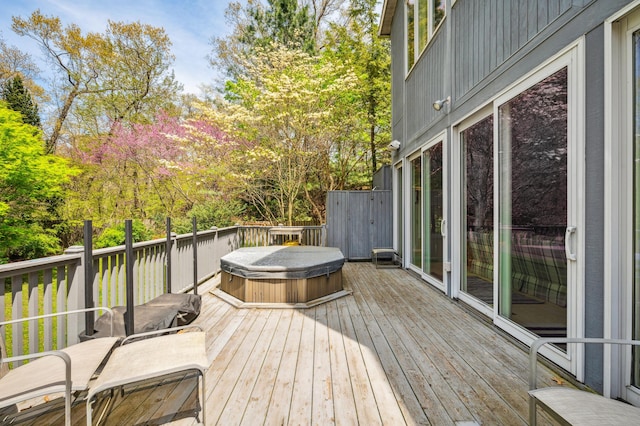 50102 Alpine Blvd, New Buffalo, MI 49117 - wooden deck featuring a covered hot tub