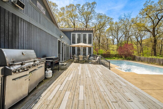 50102 Alpine Blvd, New Buffalo, MI 49117 - wooden deck featuring outdoor dining area, area for grilling, and a fenced backyard