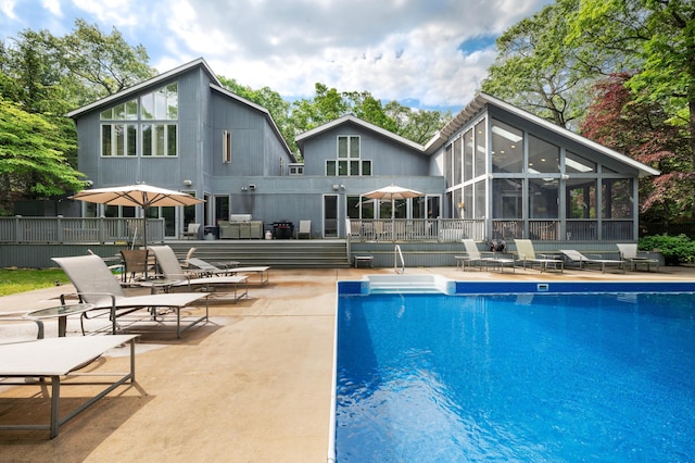 50102 Alpine Blvd, New Buffalo, MI 49117 - outdoor pool with a patio area and a sunroom