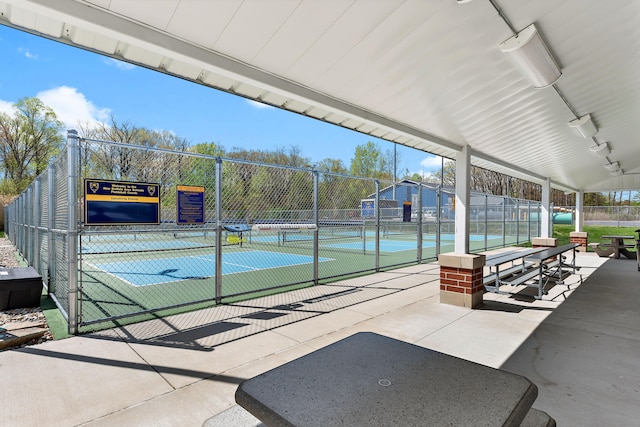 1603 E Detroit St, New Buffalo, MI 49117 - view of community featuring a tennis court, fence, and a gate