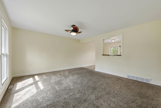 1603 E Detroit St, New Buffalo, MI 49117 - carpeted empty room featuring ceiling fan and baseboards