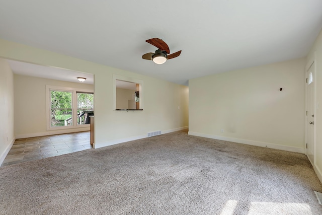 1603 E Detroit St, New Buffalo, MI 49117 - carpeted spare room with a ceiling fan and baseboards