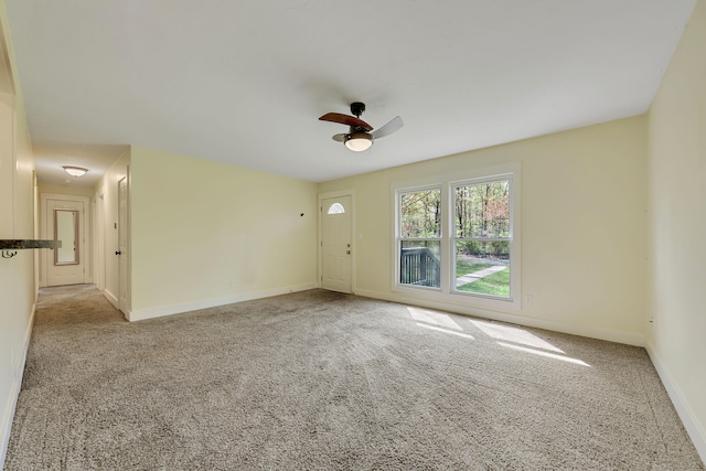 1603 E Detroit St, New Buffalo, MI 49117 - unfurnished room featuring carpet flooring, a ceiling fan, and baseboards
