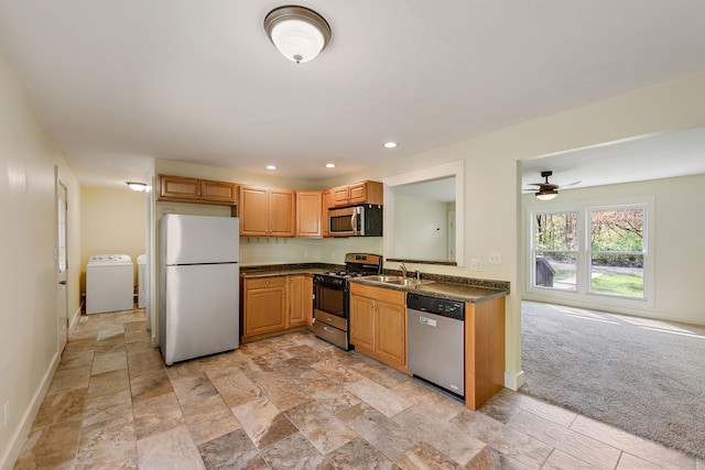 1603 E Detroit St, New Buffalo, MI 49117 - kitchen with stainless steel appliances, washer / dryer, dark countertops, baseboards, and recessed lighting