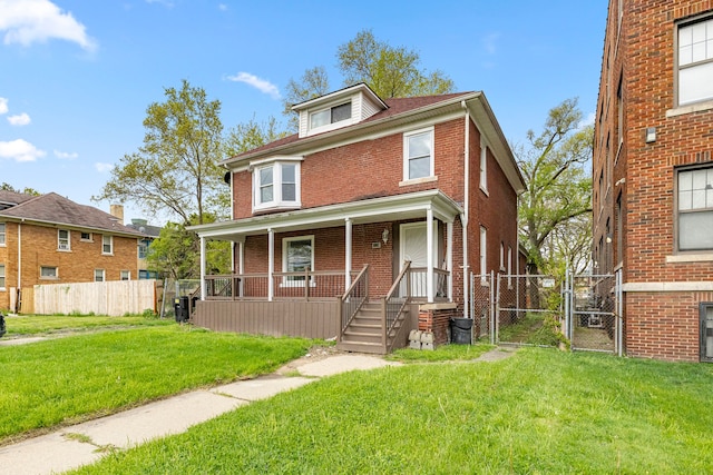 1881 W Grand Blvd, Detroit, MI 48208 - american foursquare style home featuring a gate, covered porch, and brick siding