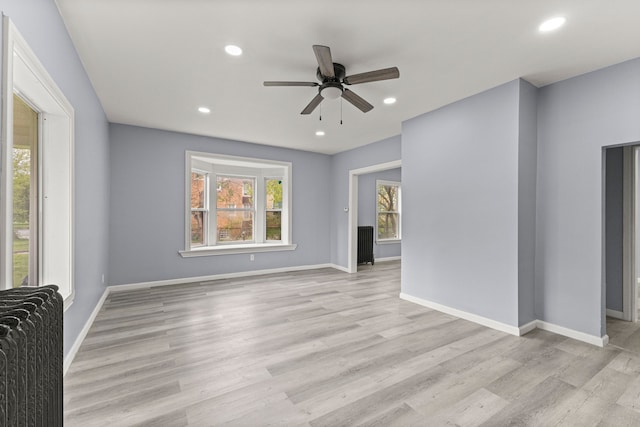 1881 W Grand Blvd, Detroit, MI 48208 - unfurnished living room featuring ceiling fan, light wood-style floors, recessed lighting, and baseboards