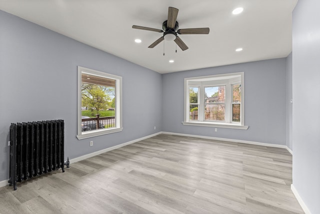 1881 W Grand Blvd, Detroit, MI 48208 - empty room with radiator, healthy amount of natural light, baseboards, and recessed lighting