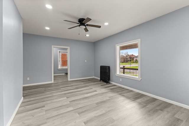 1881 W Grand Blvd, Detroit, MI 48208 - unfurnished living room with light wood-type flooring, a ceiling fan, recessed lighting, and baseboards