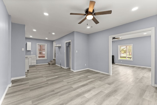 1881 W Grand Blvd, Detroit, MI 48208 - unfurnished living room with ceiling fan, light wood finished floors, recessed lighting, baseboards, and stairway