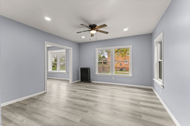 1881 W Grand Blvd, Detroit, MI 48208 - unfurnished living room featuring a ceiling fan, recessed lighting, baseboards, and light wood-style floors