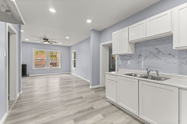 1881 W Grand Blvd, Detroit, MI 48208 - kitchen featuring a sink, ceiling fan, recessed lighting, tasteful backsplash, and white cabinets