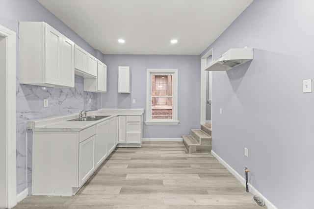 1881 W Grand Blvd, Detroit, MI 48208 - kitchen featuring a sink, white cabinets, recessed lighting, light countertops, and light wood-type flooring