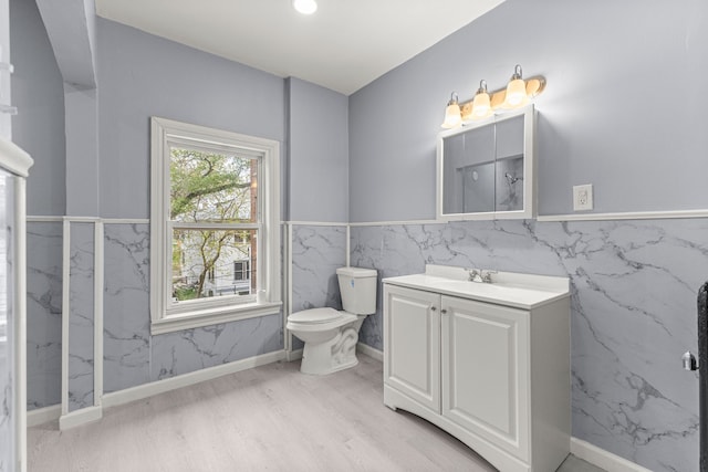 1881 W Grand Blvd, Detroit, MI 48208 - bathroom with wood finished floors, vanity, toilet, and a marble finish shower