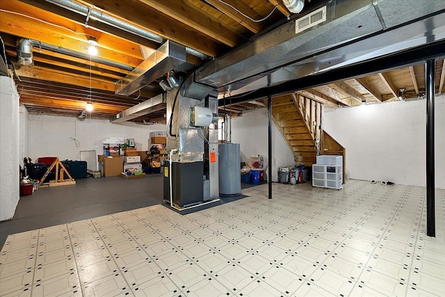 1708 Tremont Rd, Canton, MI 48188 - unfinished below grade area with water heater, heating unit, stairway, and tile patterned floors