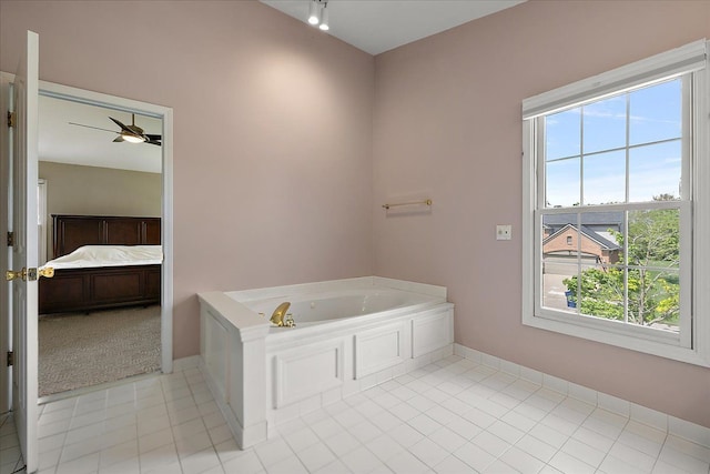 1708 Tremont Rd, Canton, MI 48188 - ensuite bathroom featuring plenty of natural light, a garden tub, tile patterned floors, and baseboards