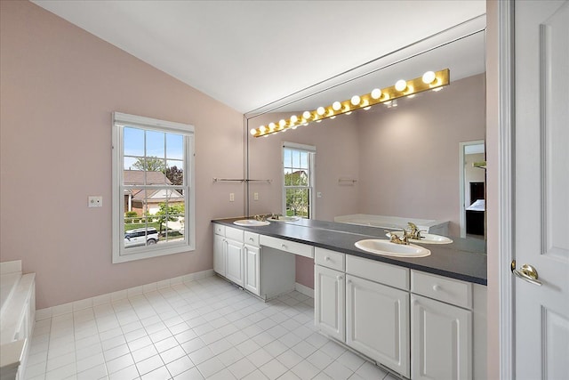 1708 Tremont Rd, Canton, MI 48188 - full bath with vaulted ceiling, double vanity, tile patterned floors, and baseboards