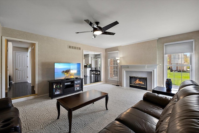 1708 Tremont Rd, Canton, MI 48188 - carpeted living room with a ceiling fan, a fireplace with flush hearth, and baseboards