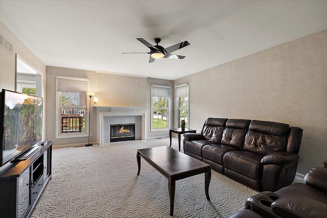 1708 Tremont Rd, Canton, MI 48188 - carpeted living area with ceiling fan, healthy amount of natural light, and a fireplace with flush hearth