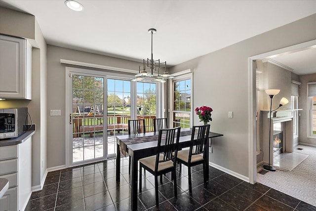 1708 Tremont Rd, Canton, MI 48188 - dining area with baseboards, healthy amount of natural light, a fireplace with flush hearth, and recessed lighting