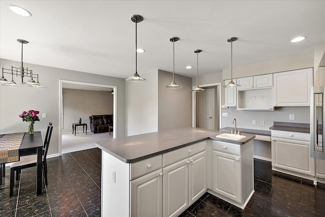 1708 Tremont Rd, Canton, MI 48188 - kitchen with a sink, white cabinets, a kitchen island, recessed lighting, and baseboards