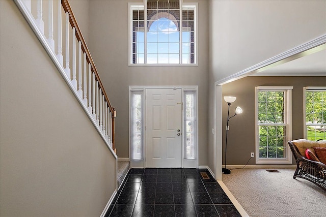 1708 Tremont Rd, Canton, MI 48188 - foyer featuring granite floors, stairway, baseboards, and a high ceiling
