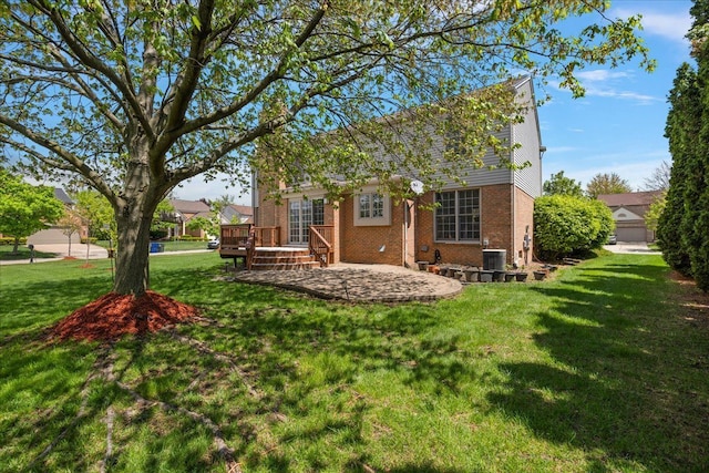 1708 Tremont Rd, Canton, MI 48188 - view of side of property featuring a wooden deck, a yard, brick siding, a patio, and cooling unit