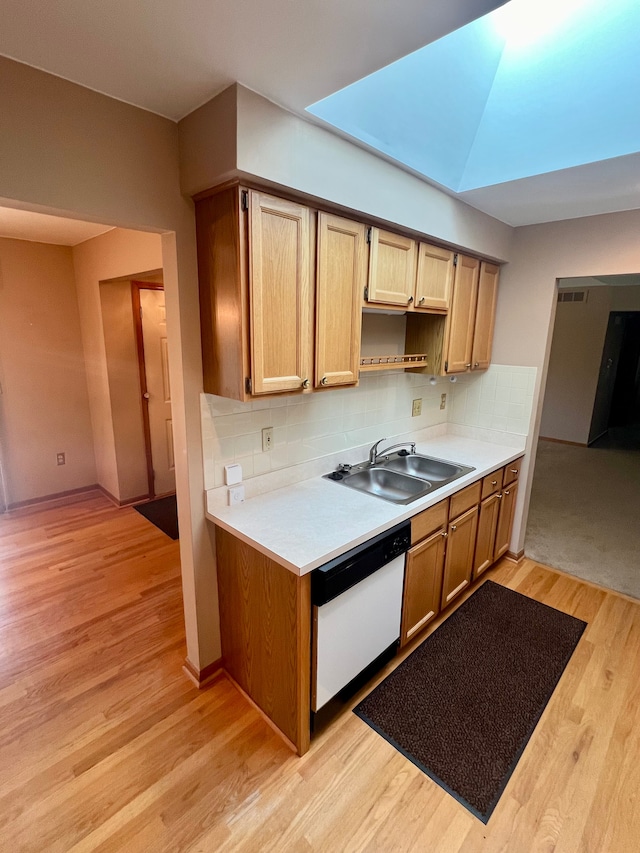 49421 Northwood, Shelby Twp, MI 48315 - kitchen featuring white dishwasher, a sink, light countertops, light wood-style floors, and tasteful backsplash