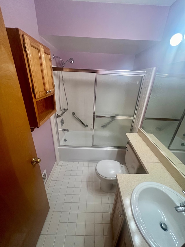 49421 Northwood, Shelby Twp, MI 48315 - full bathroom featuring tile patterned floors, combined bath / shower with glass door, vanity, and toilet