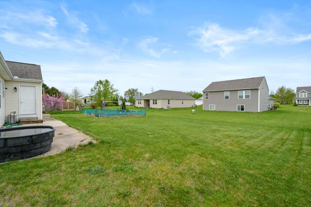 4143 Wild Meadow St, Kalamazoo, MI 49048 - view of green lawn with a swimming pool