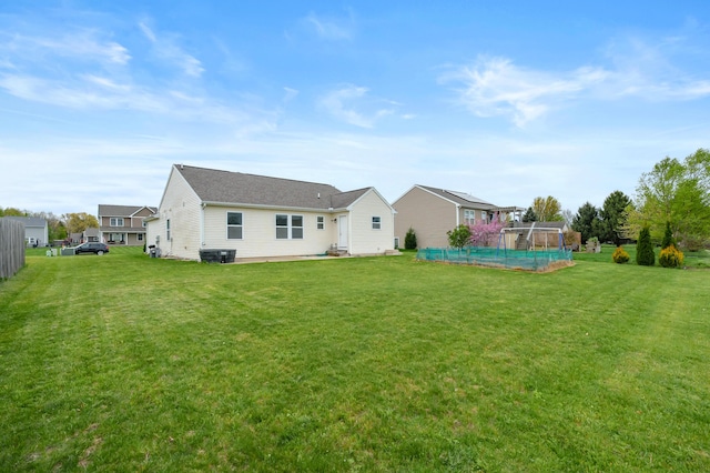 4143 Wild Meadow St, Kalamazoo, MI 49048 - rear view of property with a lawn and central air condition unit