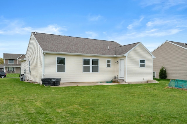 4143 Wild Meadow St, Kalamazoo, MI 49048 - rear view of property with a lawn and roof with shingles