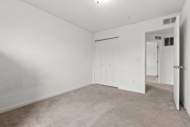 4143 Wild Meadow St, Kalamazoo, MI 49048 - unfurnished bedroom featuring light carpet, baseboards, and a closet